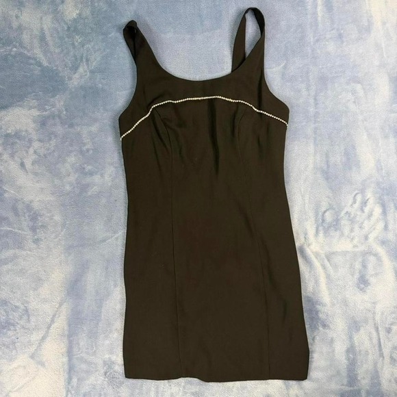 The Unbranded Brand Dresses & Skirts - Vintage onyx nite Black bodycon mini dress with white trim. Size: 10